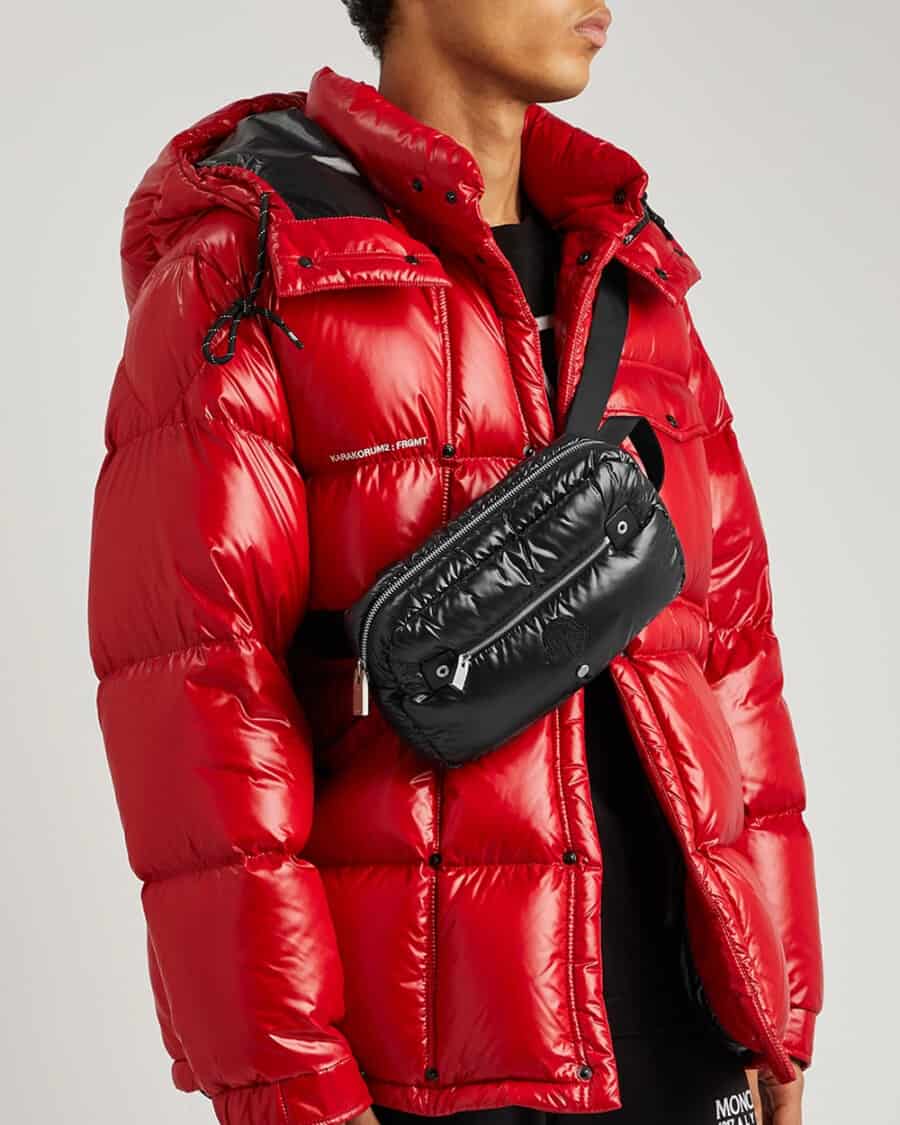 Man wearing a ALYX x Moncler red puffer jacket and padded crossbody bag