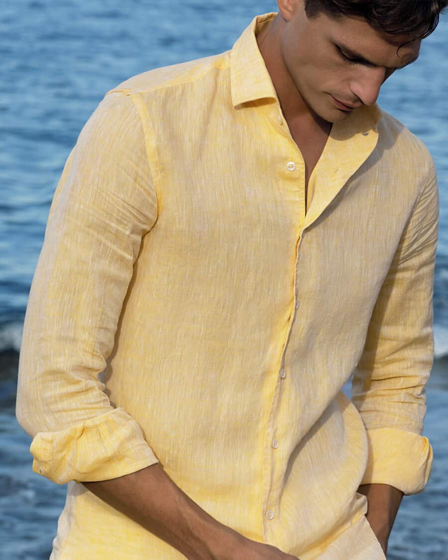 Man wearing yellow linen shirt