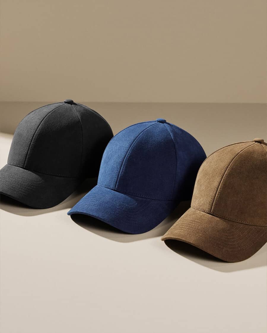 Three luxury men's. baseball caps in black, blue and olive colours