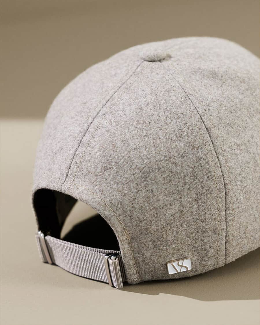 Close up of the back fastening of a premium men's grey baseball cap