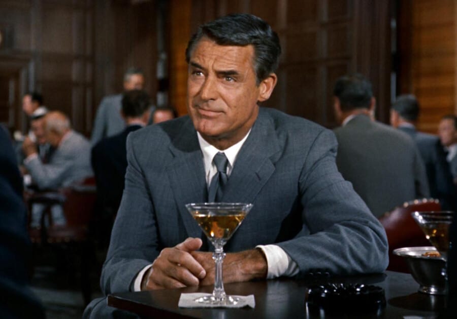 Cary Grant wearing an immaculate old money suit in North by North West