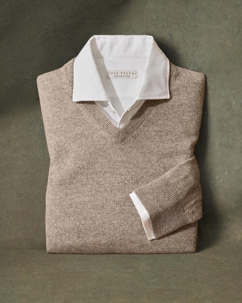 Beige cashmere V-neck sweater layered over a made in Italy white shirt by Luca Faloni