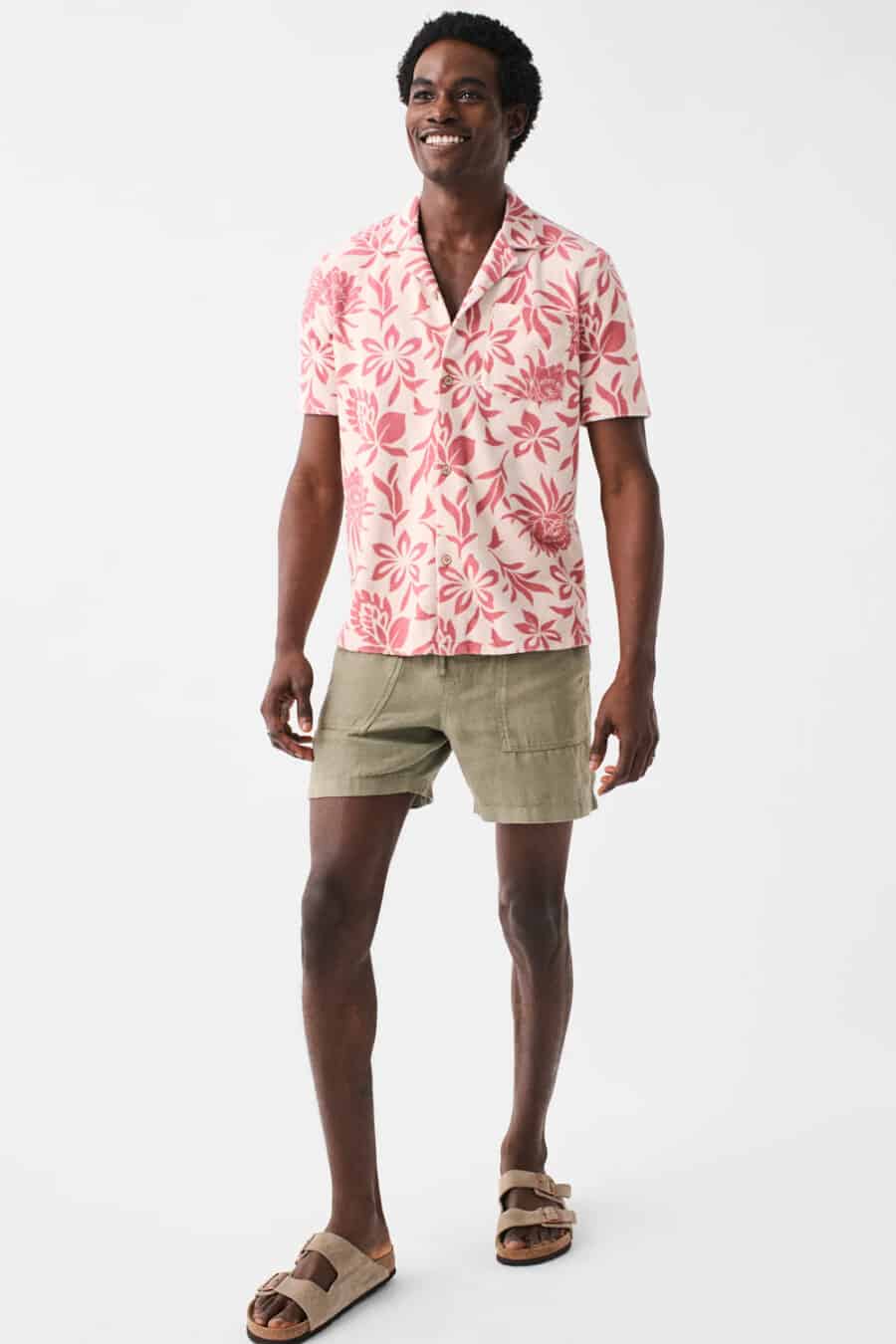 Men's light green short shorts, pink/white floral shirt and taupe slider sandals outfit