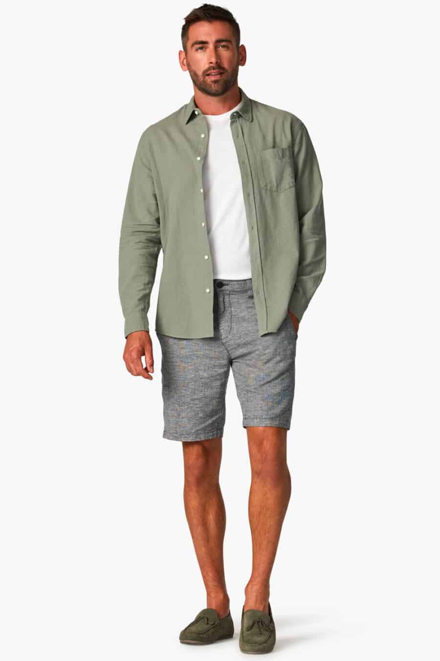 Men's grey shorts, white T-shirt, green open shirt and suede green driving shoes outfit