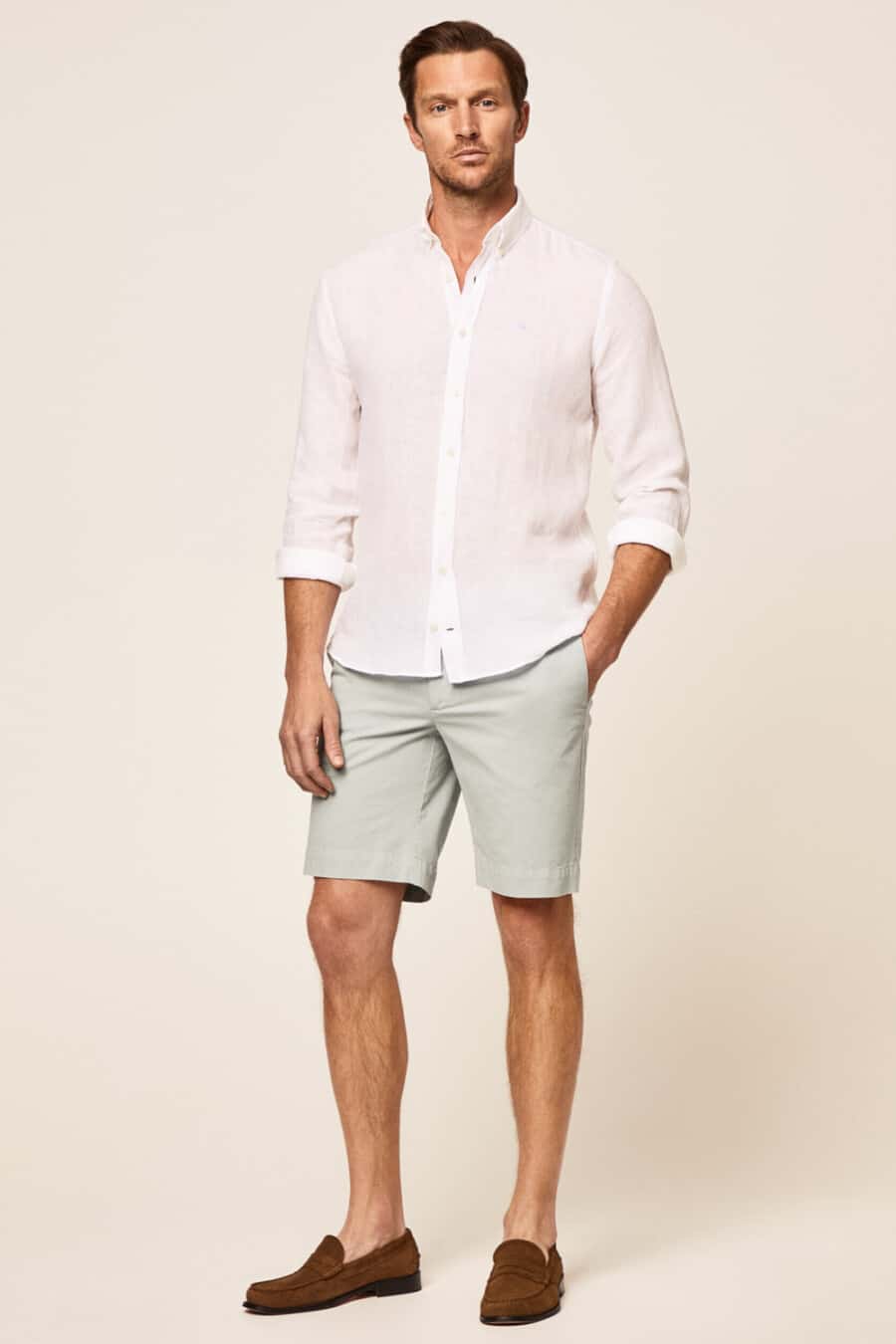 Men's light grey shorts, white linen shirt and brown suede loafers outfit