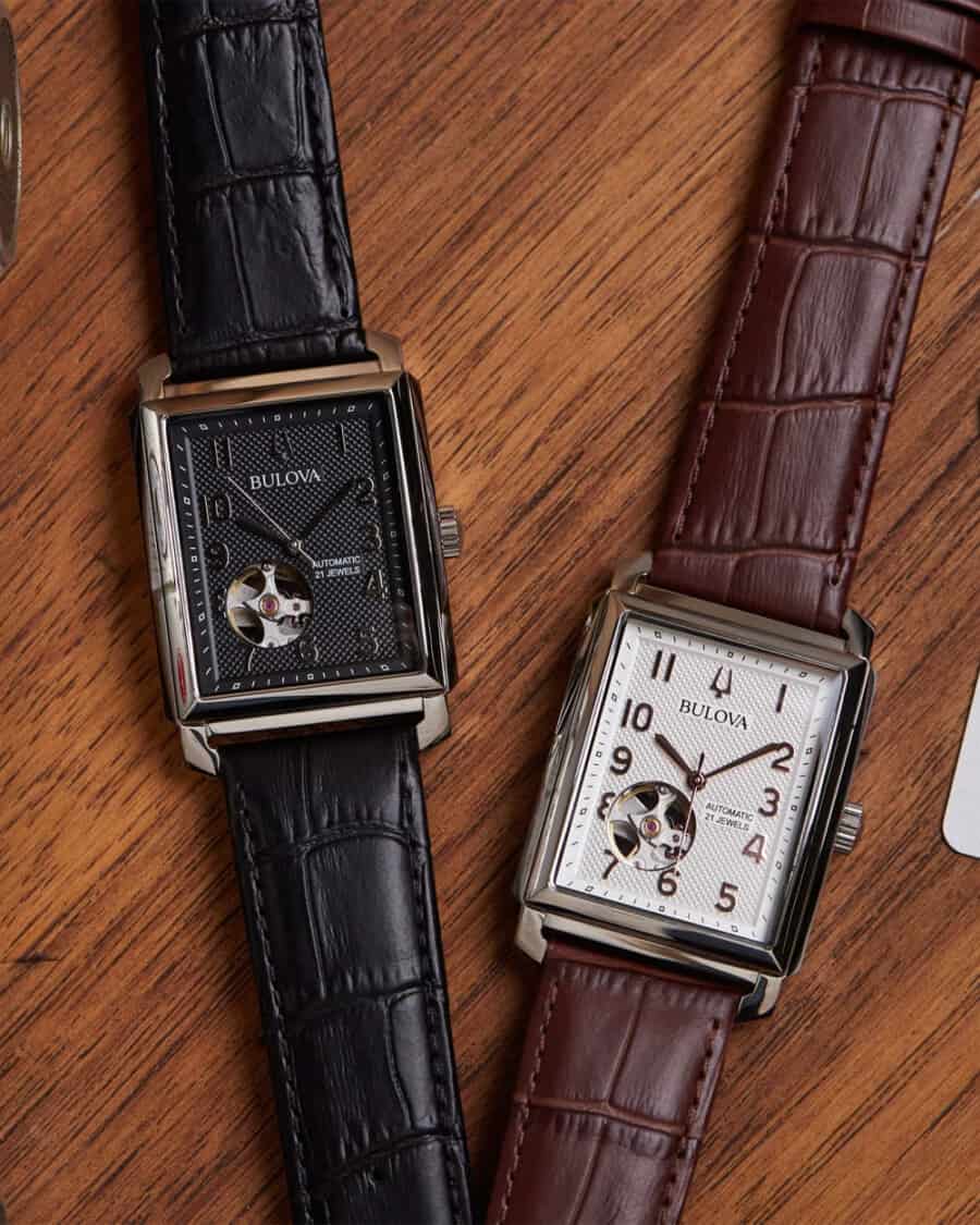 Two Bulova Sutton automatic rectangular watches side by side