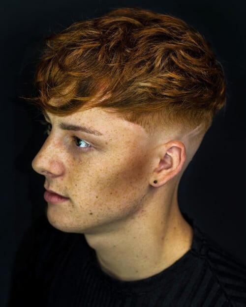 Ginger mid-length messy mop with a low skin fade