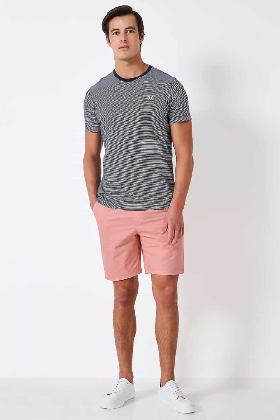 Men's pink shorts, navy/white fine striped T-shirt and white sneakers outfit