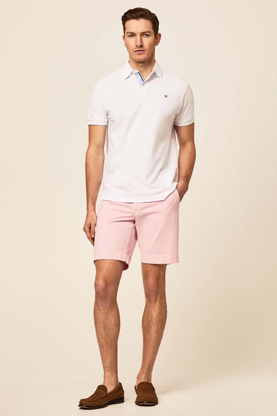 Men's pale pink shorts, white polo shirt and brown suede penny loafers outfit