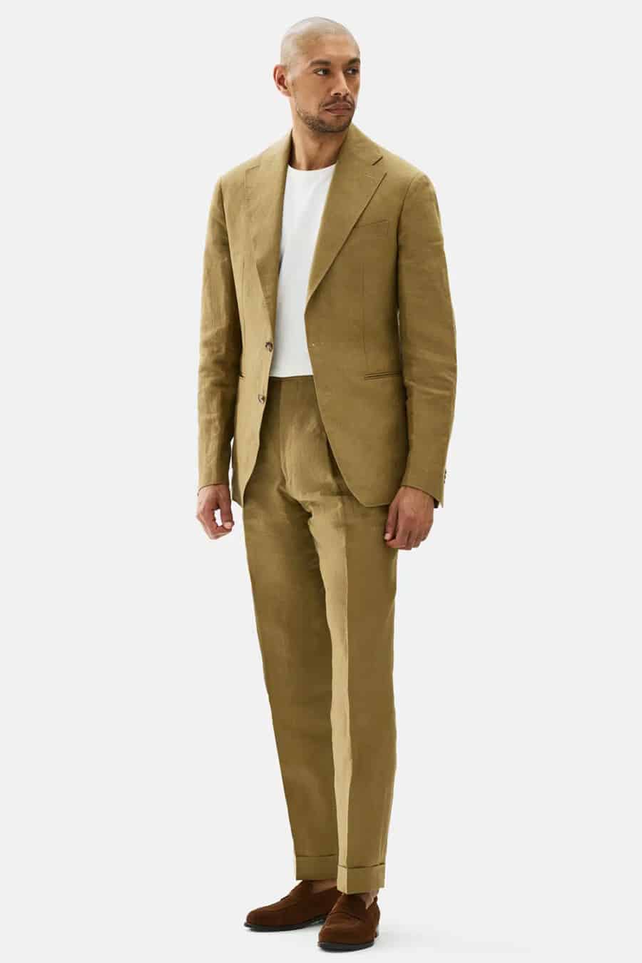Men's khaki suit, white T-shirt and brown suede penny loafers outfit