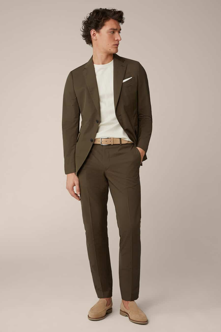 Men's olive green suit, white T-shirt and khaki suede shoes outfit