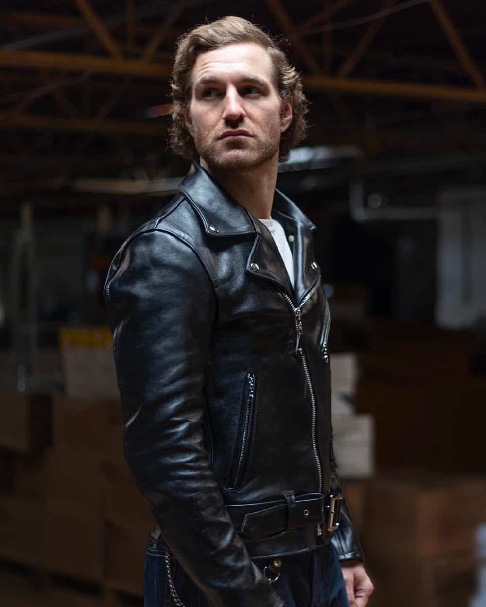 Man wearing a Schott black leather Perfecto biker jacket with jeans