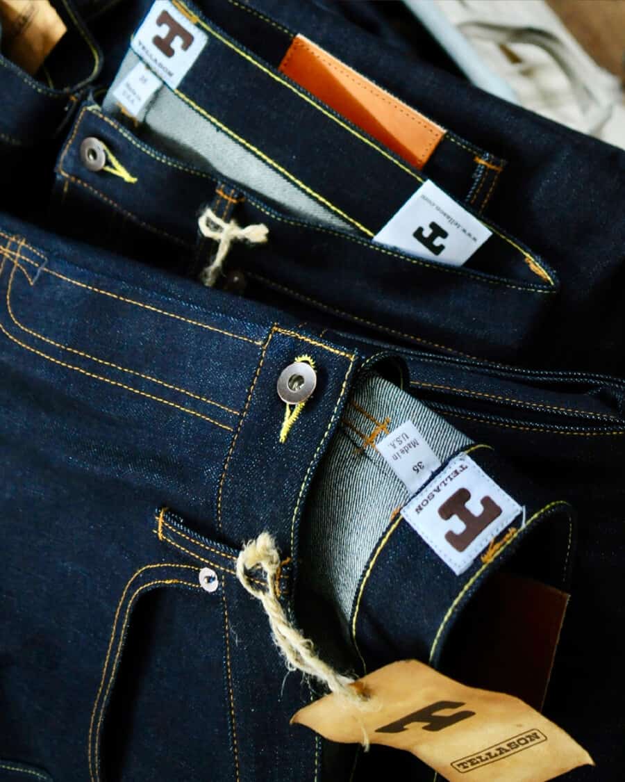 Close up of multiple raw selvedge denim jeans by Tellason