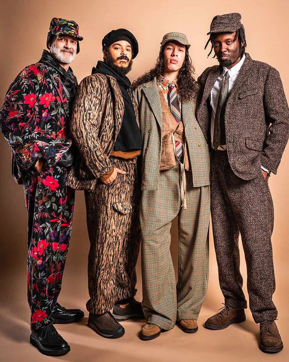 Four men wearing wild printed coordinating pieces or heritage tailoring by Engineered Garments 
