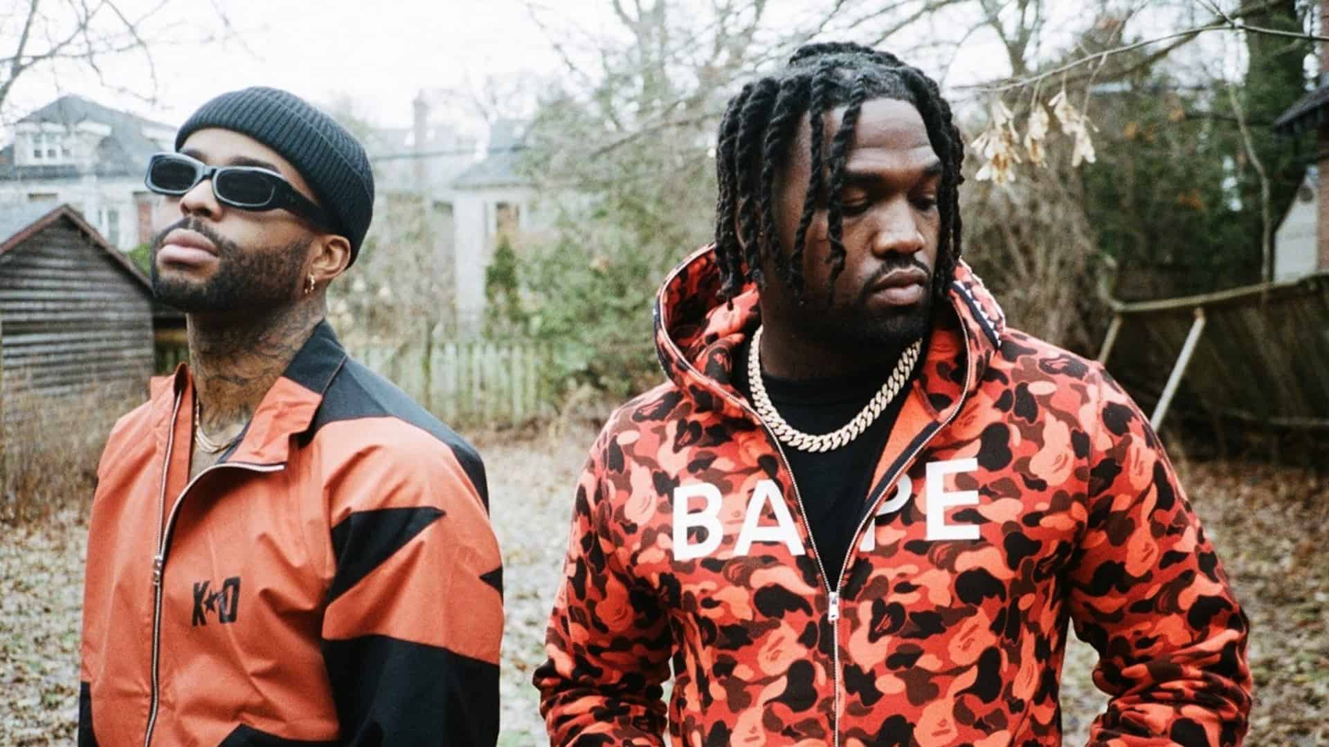 Two men wearing A Bathing Ape / BAPE red jackets and camo hoodie