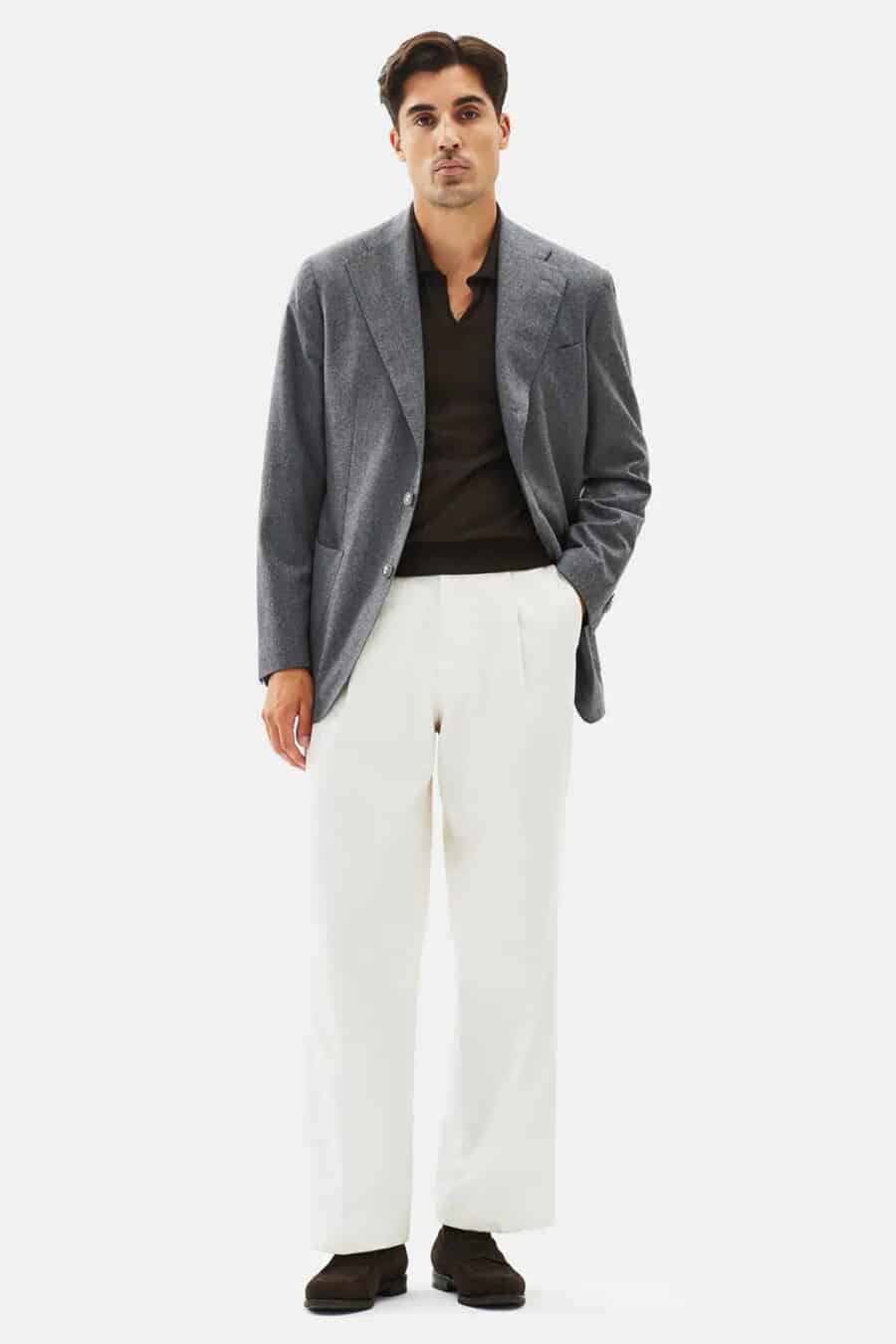 Men's loose white pants, black open collar polo shirts, charcoal wide notch lapel blazer and brown suede loafers