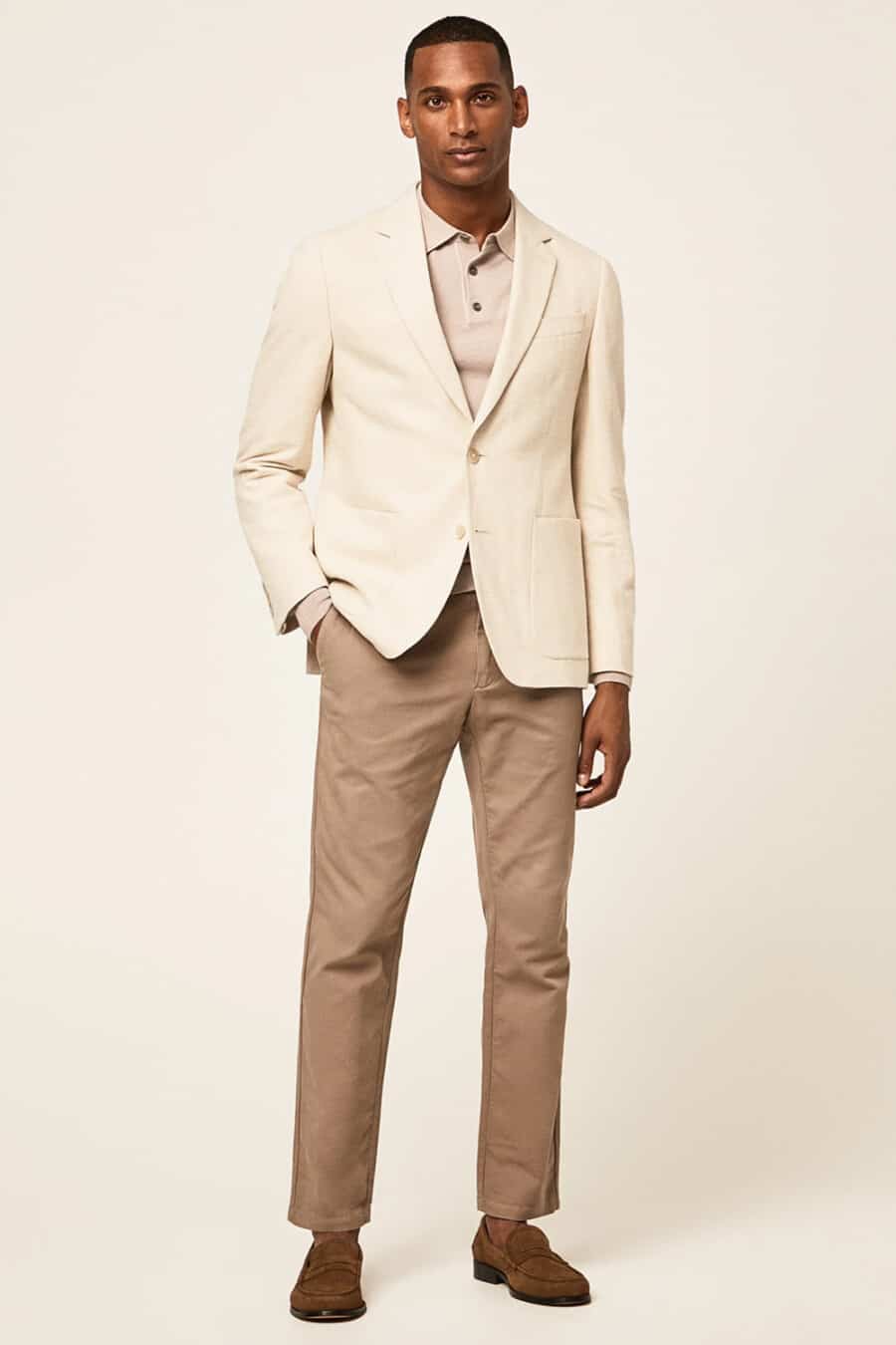 Men's brown pants, taupe polo shirt, cream blazer and brown suede penny loafers outfit