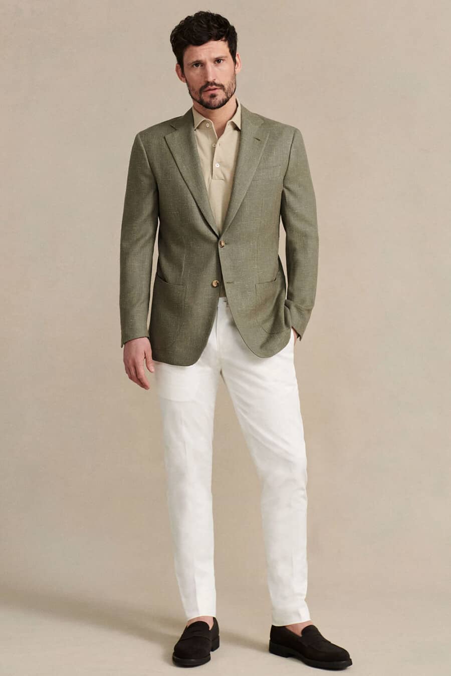 Men's white pants, beige polo shirt, green blazer and brown suede penny loafers outfit