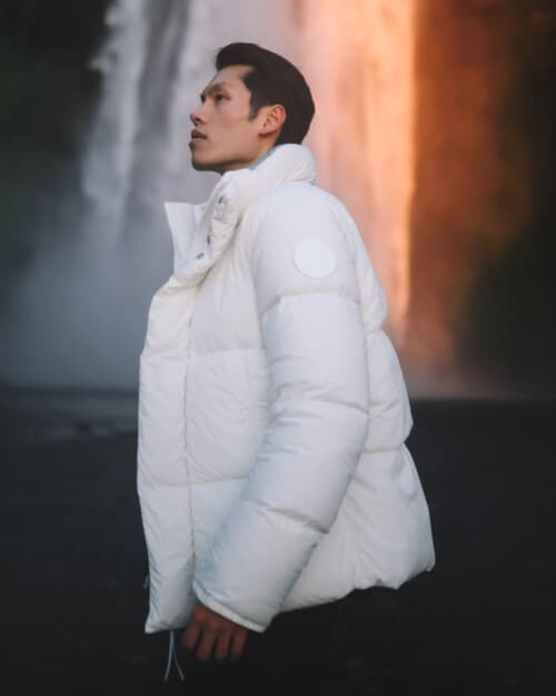 Man wearing a bright white Canada Goose long padded parka jacket