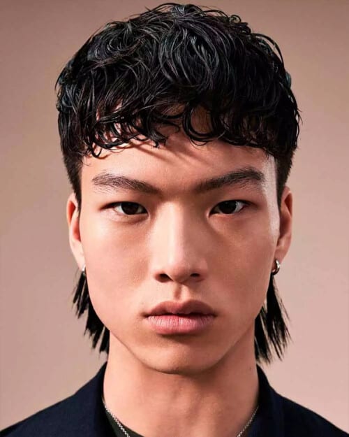 Asian men's mid-length, wet-look black hair in wolf cut