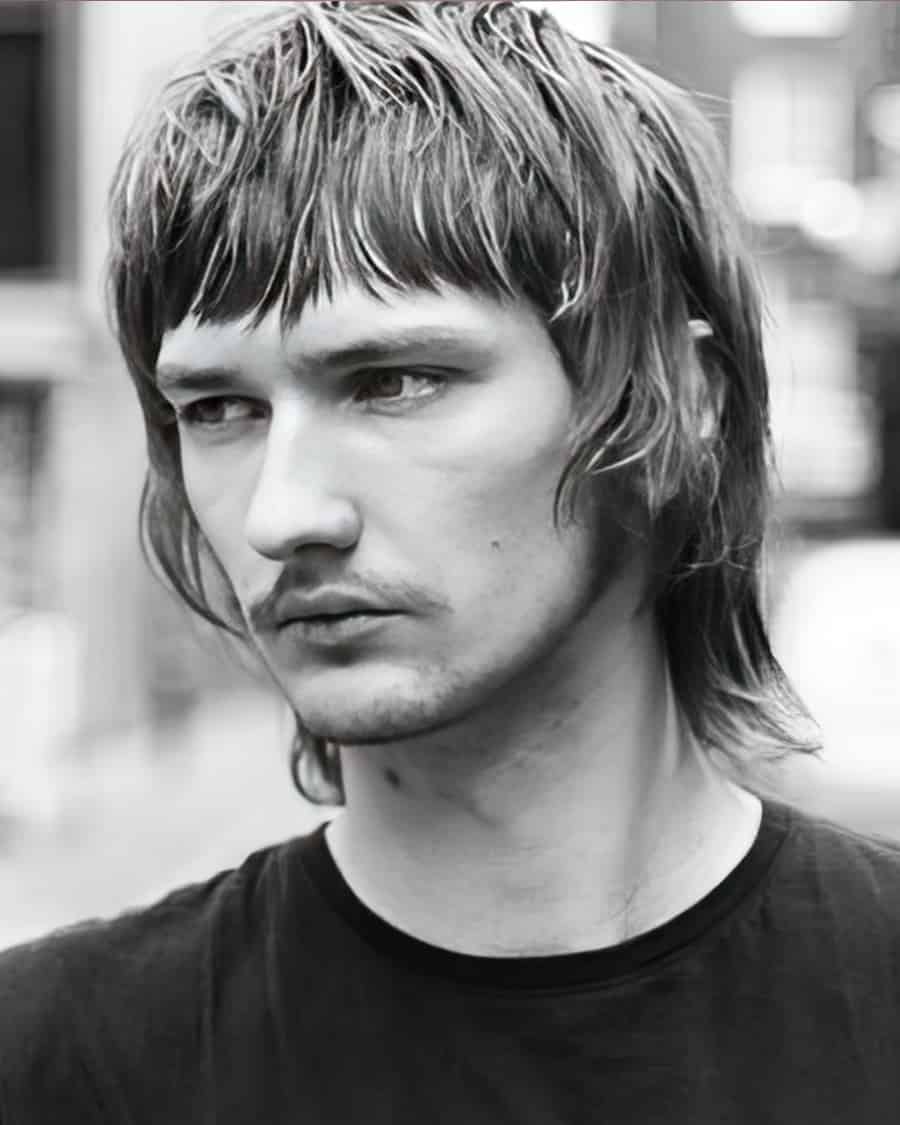 Men's wolf cut with a full blunt fringe