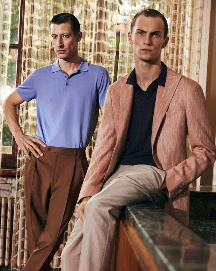 Two men wearing tailored pants, premium knitted polo shirts with a blazer