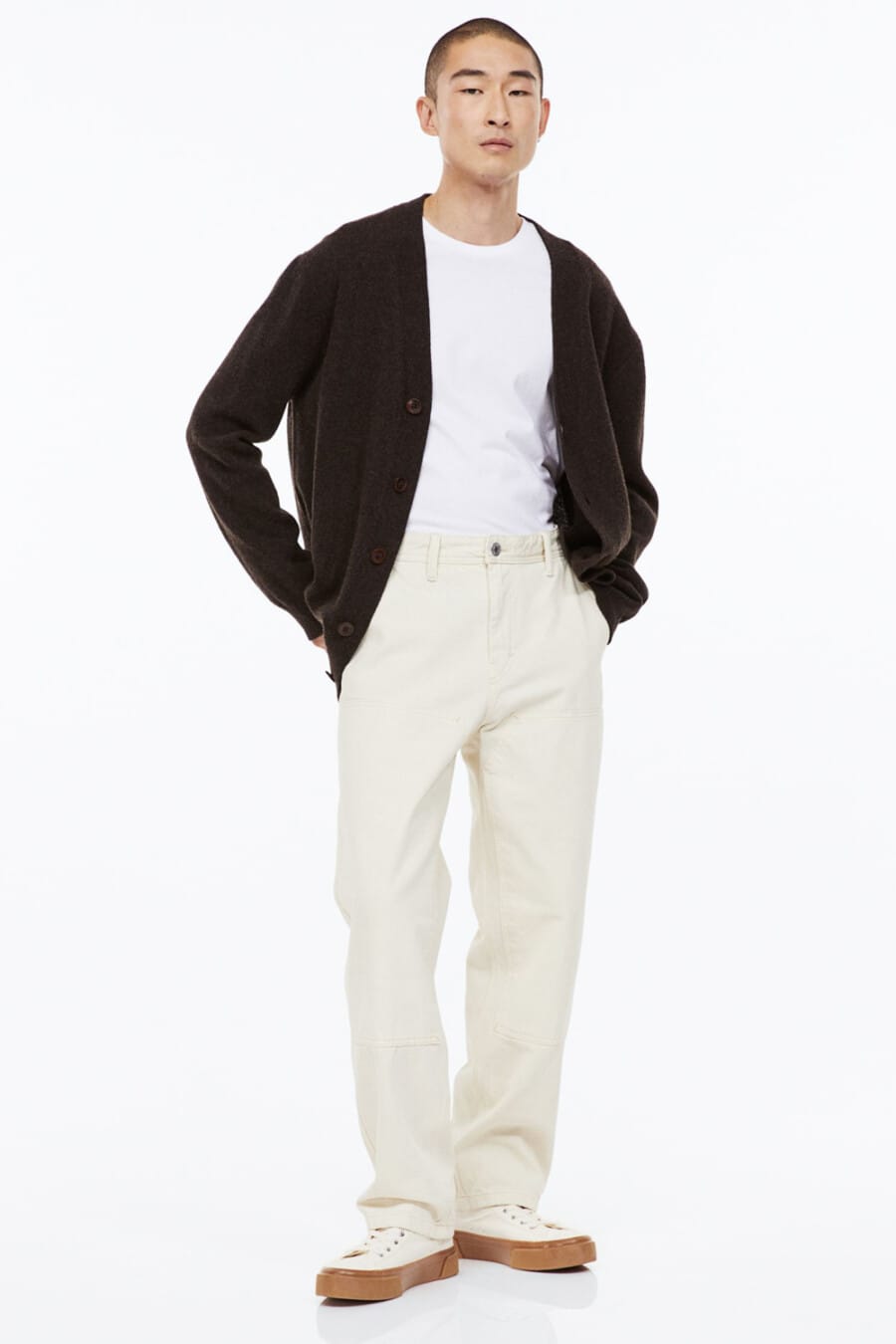 Men's baggy off-white jeans, white tucked in T-shirt, brown cardigan and off-white gum sole sneakers outfit