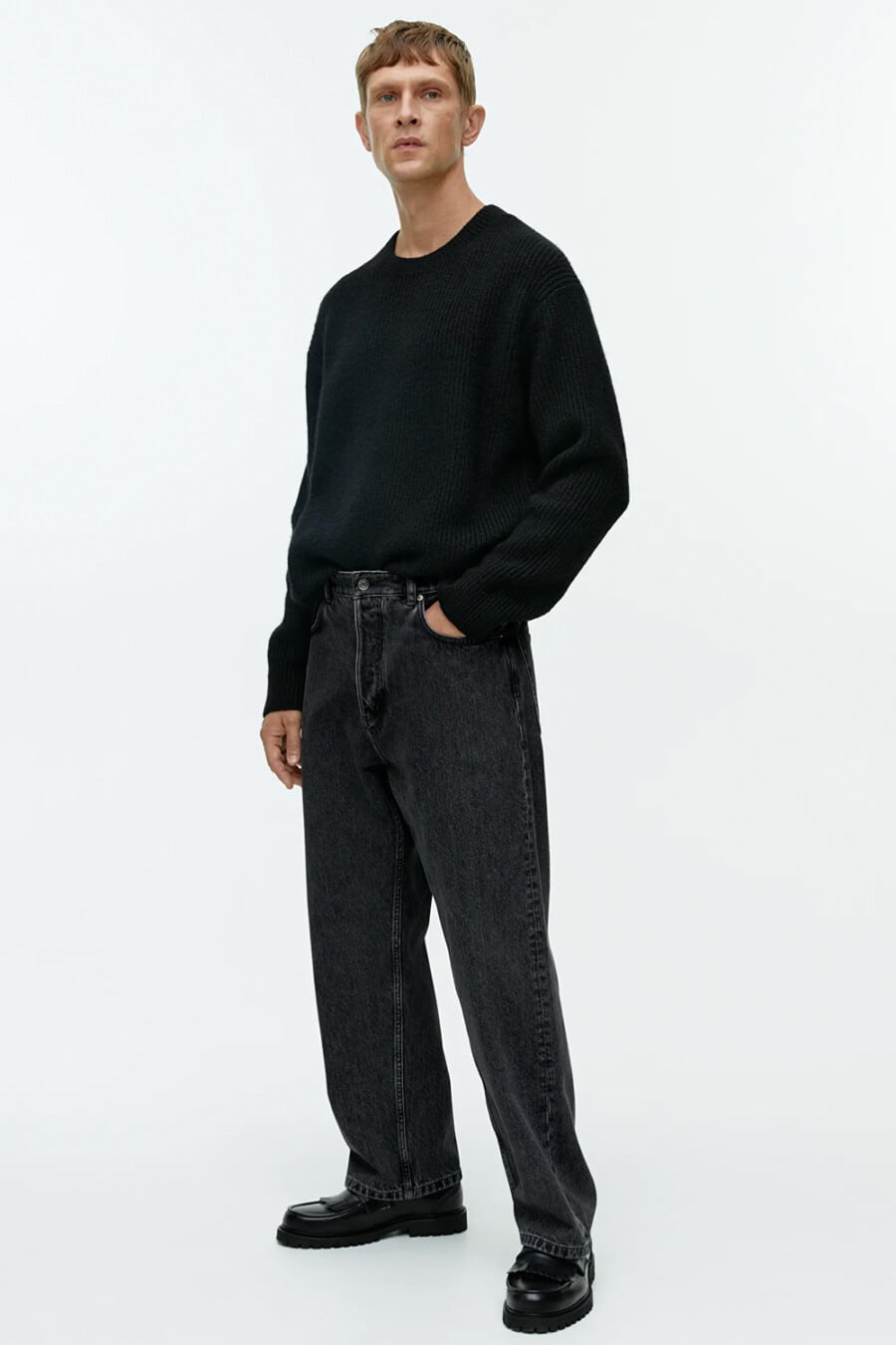 Men's black baggy jeans, oversized black sweater and black chunky fringed loafers outfit