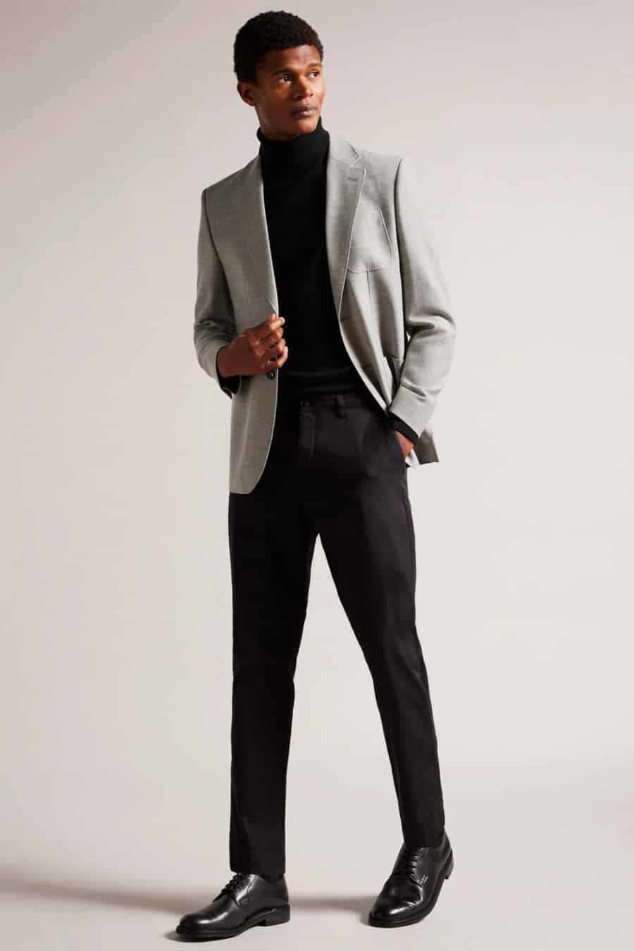 Men's black pants, black turtleneck, light grey blazer and black leather Derby shoes outfit