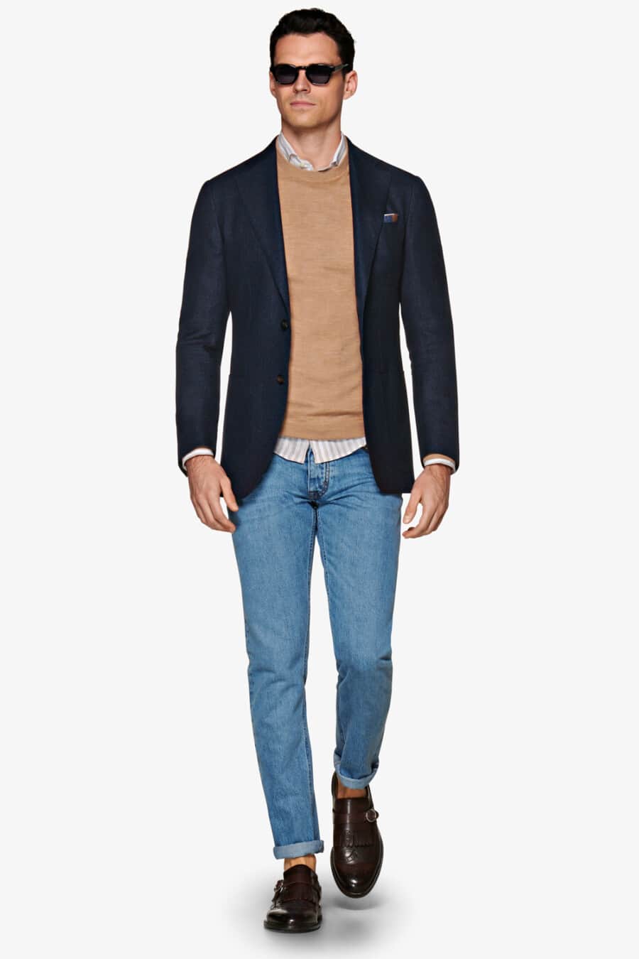 Men's Navy blazer, blue jeans, white striped shirt, camel crew-neck sweater and brown leather monk strap shoes worn sockless outfit