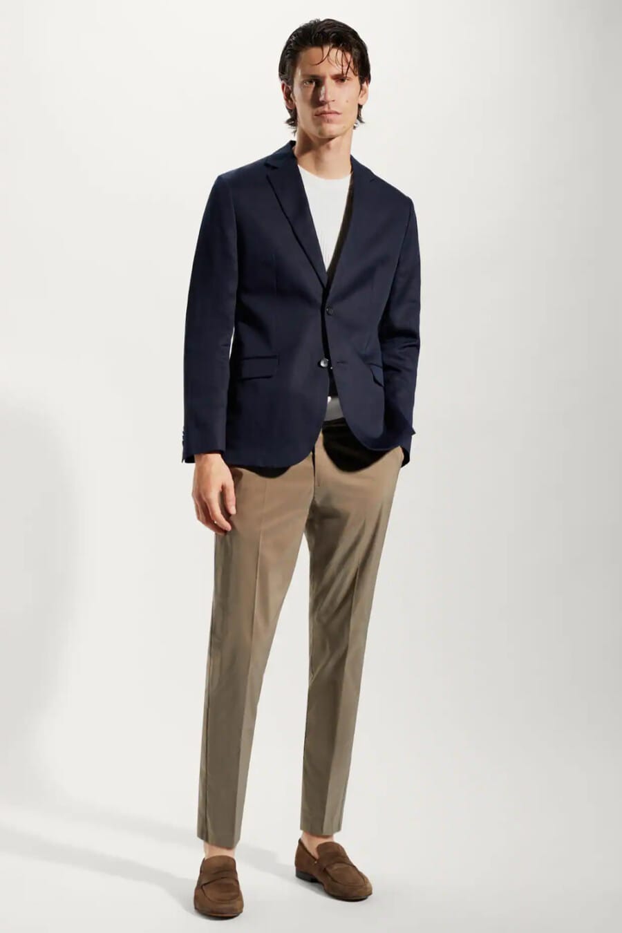 Men's Navy single-breasted blazer, cropped light brown pants, white T-shirt and brown suede penny loafers outfit