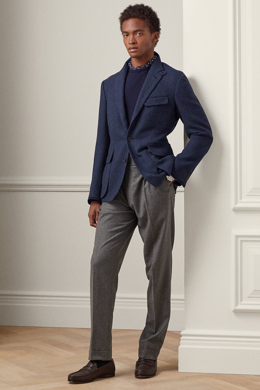 Navy knitted blazer, navy crew-neck sweater, dark grey tailored wool pants and brown leather penny loafers outfit