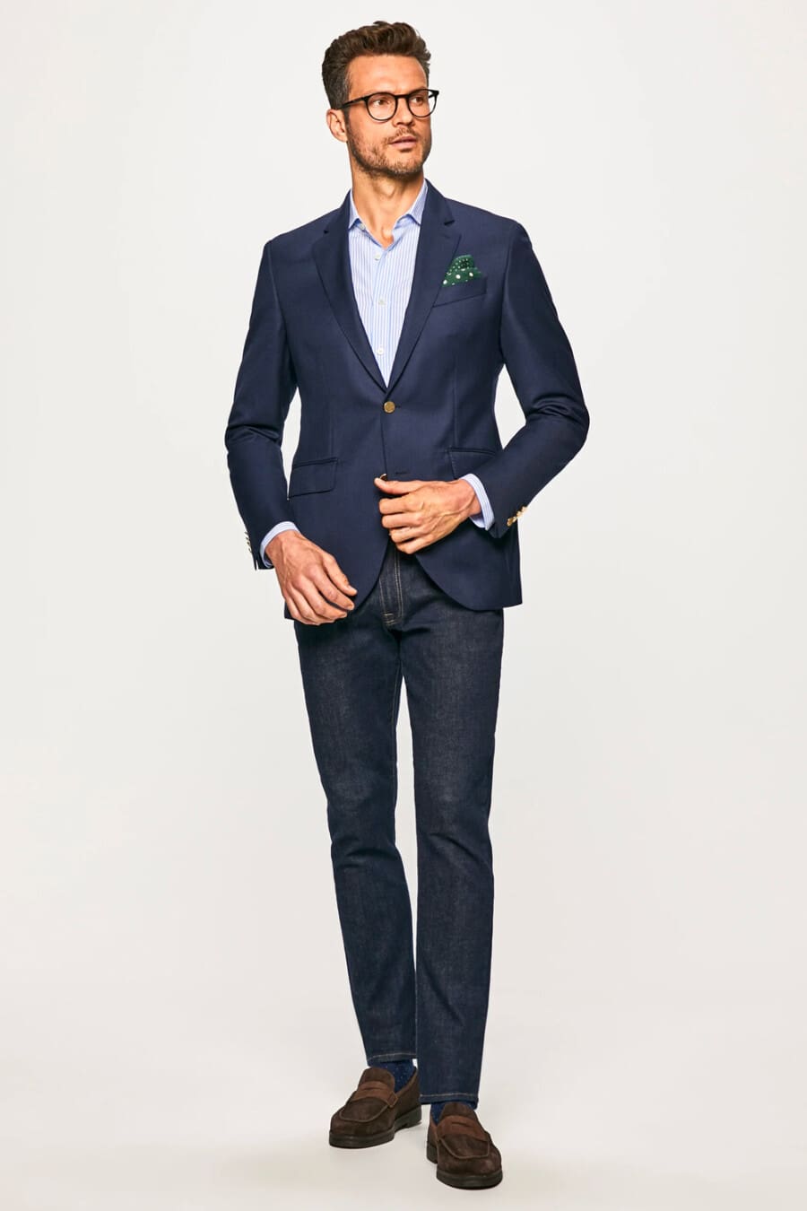 Men's Navy single-breasted blazer, dark raw denim jeans, light blue striped shirt and brown suede penny loafers outfit