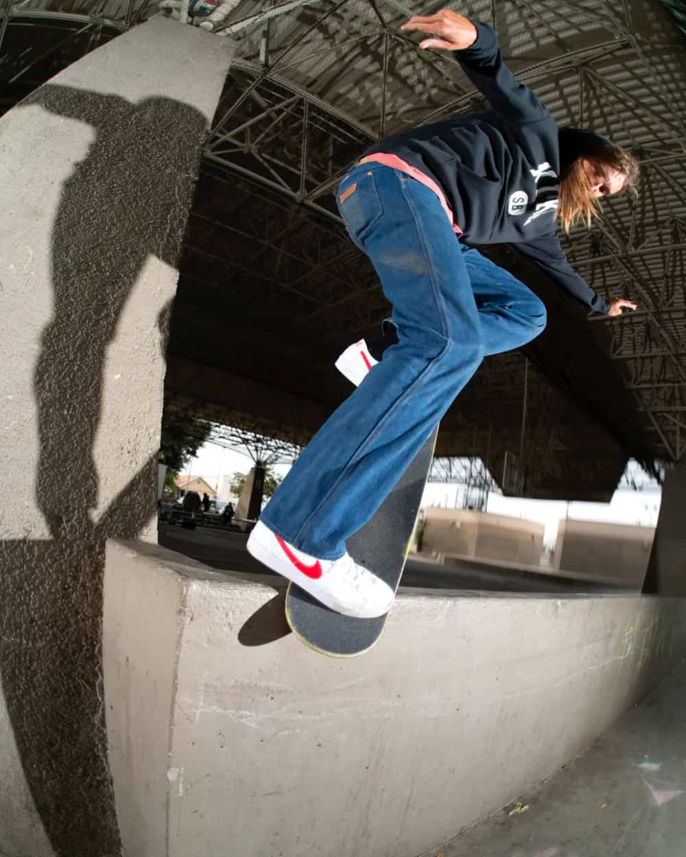 Skater on board wearing Nike SB clothing