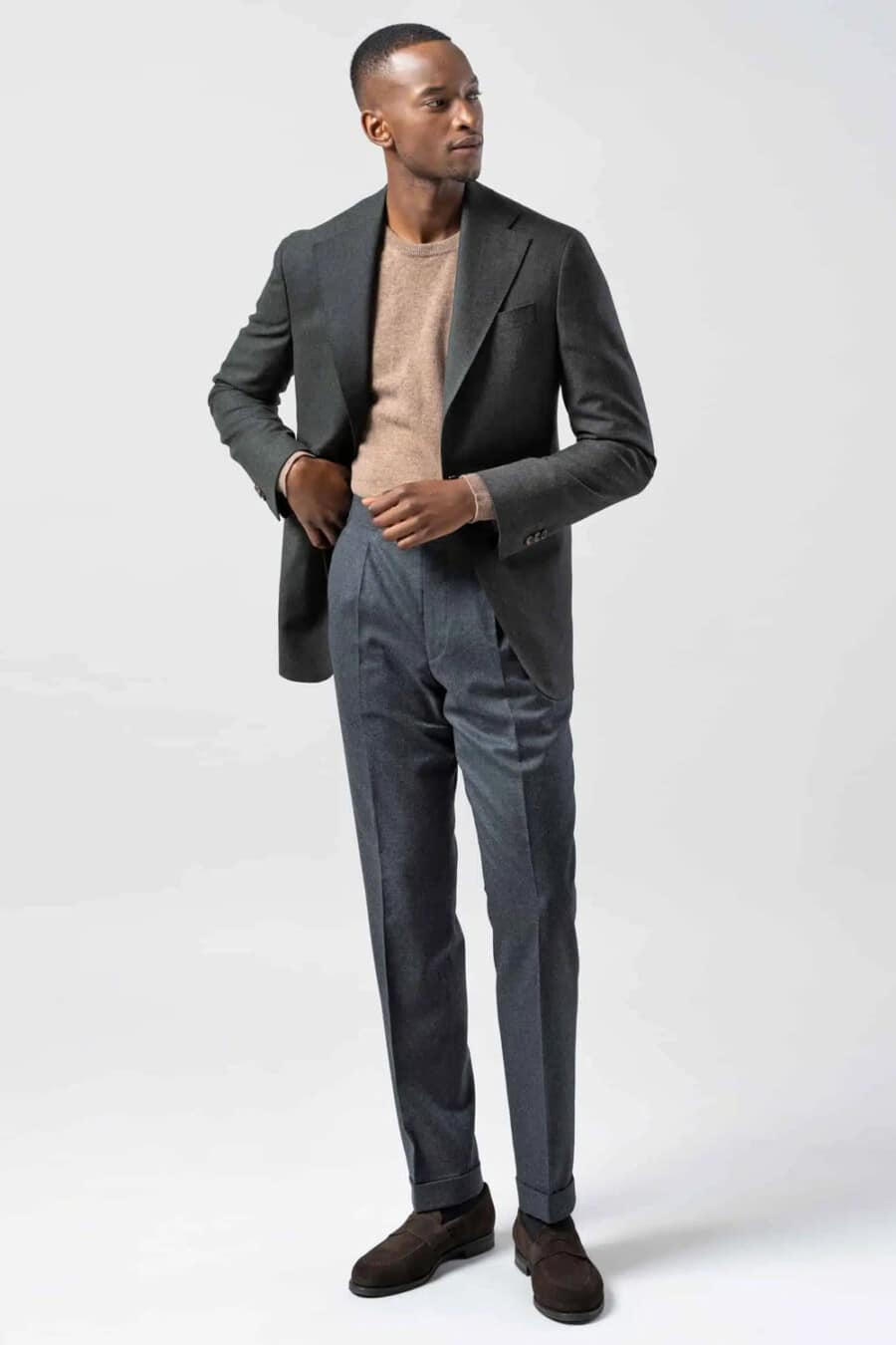 Men's grey flannel tailored pants, camel merino crew neck sweater, grey flannel blazer and brown suede penny loafers outfit