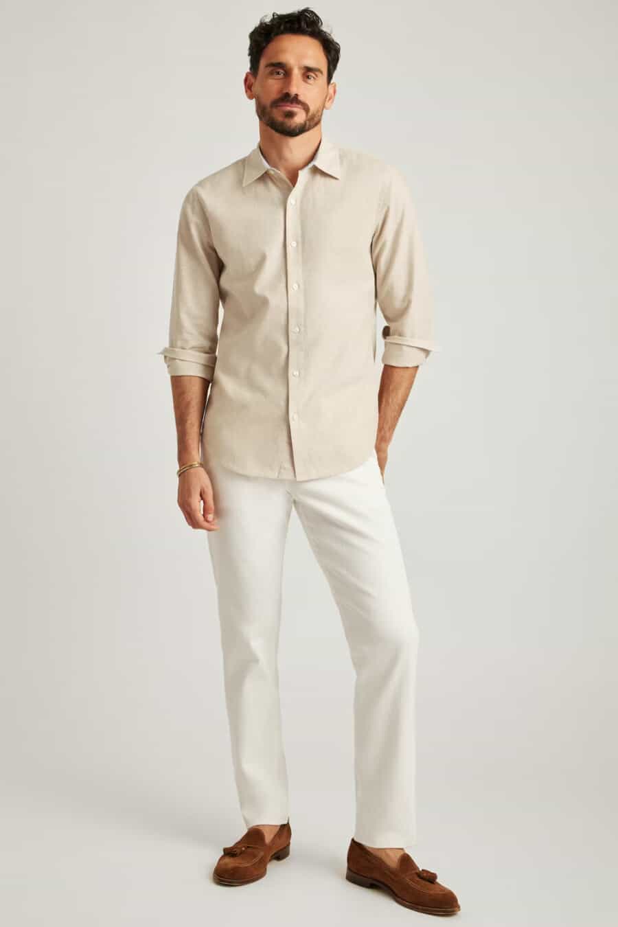 Men's white jeans, beige shirt and tan suede tassel loafers outfit