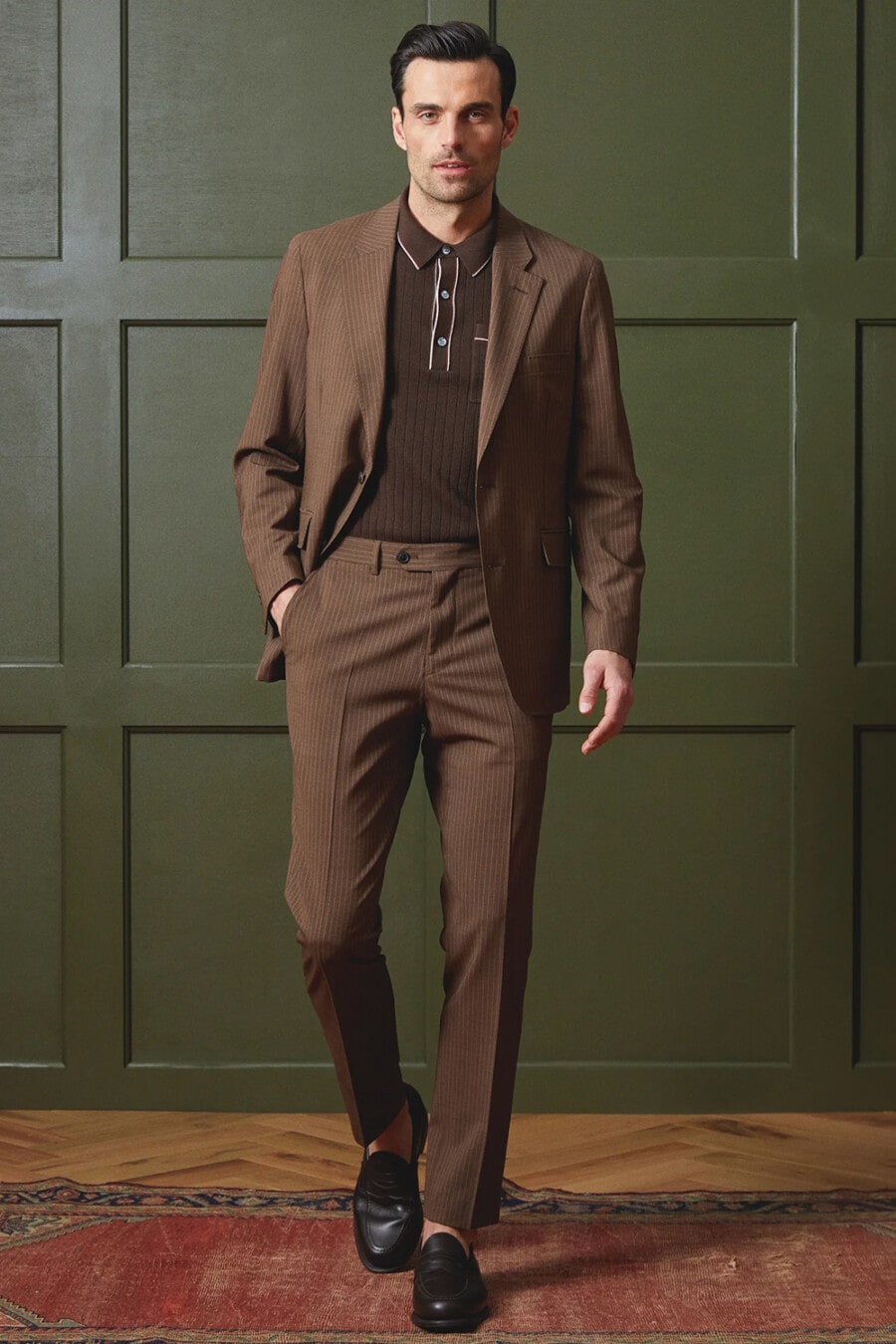 Men's brown suit, brown knitted polo shirt and black leather penny loafers worn sockless outfit 
