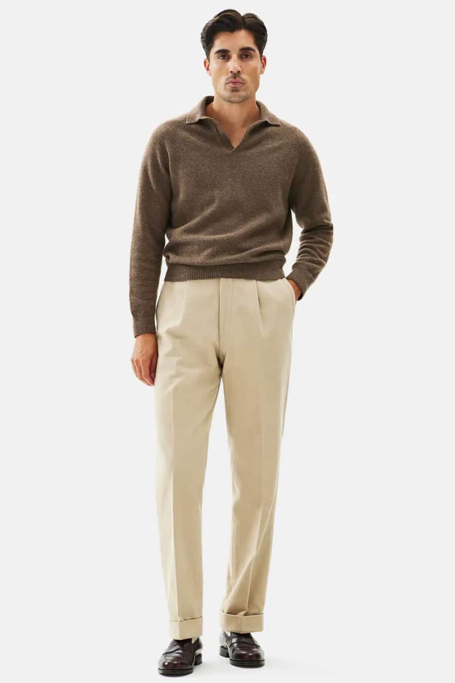 Men's pleated khaki pants, brown long sleeve polo shirt and brown leather penny loafers outfit