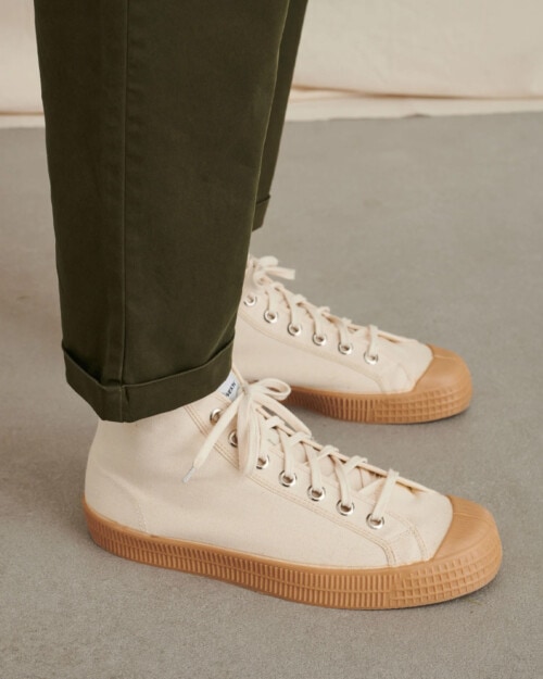 Novesta Star Dribble Classic Beige canvas sneaker worn on feet with green pants