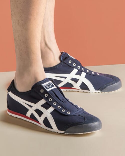 Onitsuka Tiger Mexico 66 Slip-on Canvas Sneaker in navy worn on feet with no socks