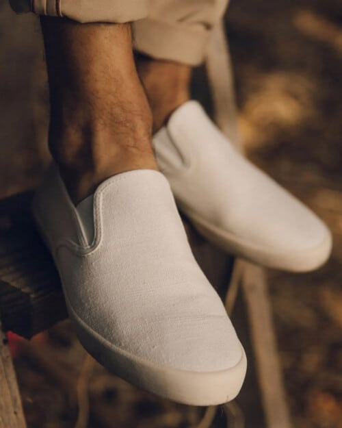 SeaVees Baja Slip On Canvas Sneaker in white worn on feet sockless