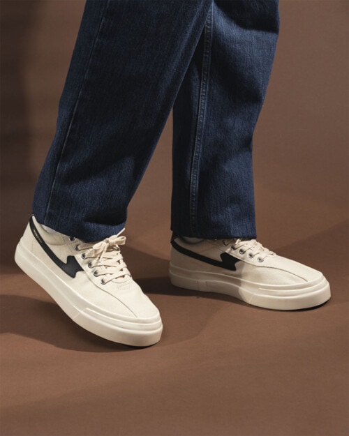 Stepney Workers Club Dellow S-Strike Canvas Sneaker worn on feet with jeans