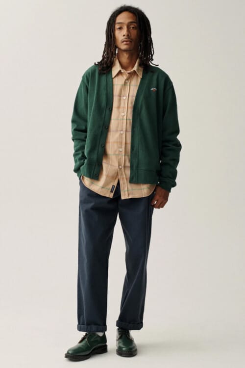 Men's navy wide pants, camel check shirt, green baseball cardigan and green leather shoes outfit