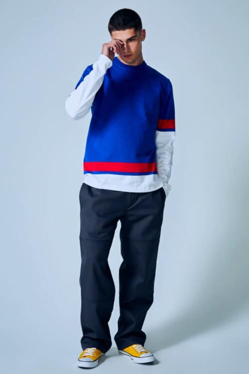 Men's navy skate pants, yellow canvas sneakers, long sleeve blue white and red top outfit