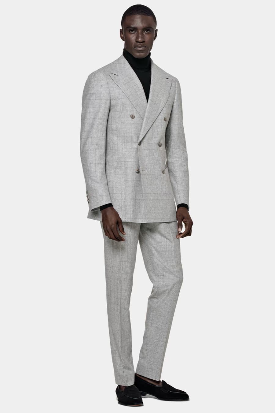 Men's light grey check double-breasted suit, black turtleneck and black suede Belgian loafers outfit