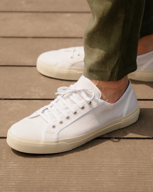 Velasca Saltafoss white linen canvas sneaker worn on feet sockless with green pants