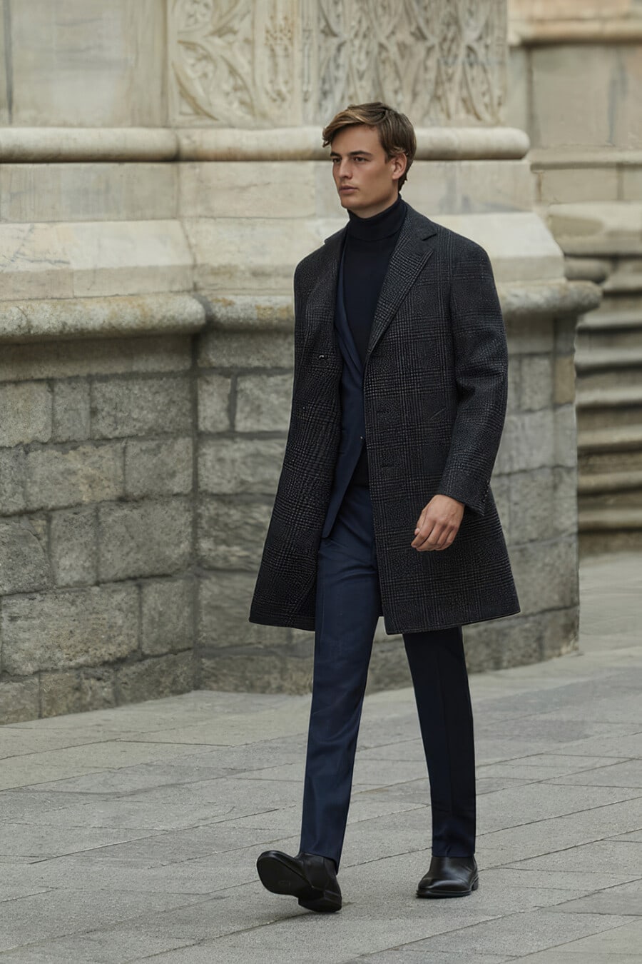 Man wearing navy suit, navy turtleneck, grey check overcoat and black leather Chelsea boots outfit