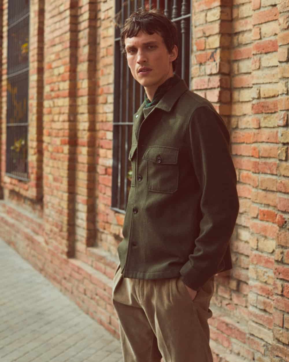 Man wearing a Hartford dark green flannel shacket with olive green pants