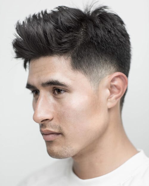 Men's messy mid-length spiky fringe hairstyle with temple fade