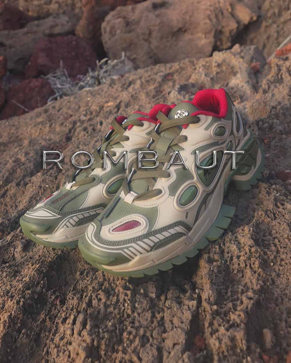 A pair of chunky Rombaut Nucleo Quicksilver sneakers in green and beige on some rocks